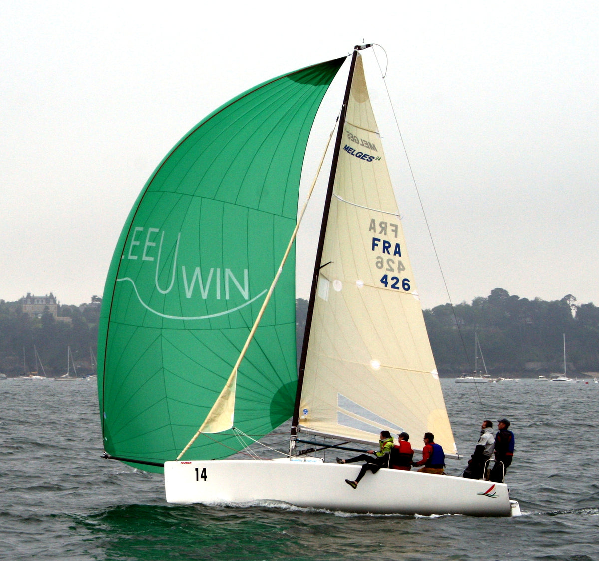 Melges 24 sailing under a green gennaker